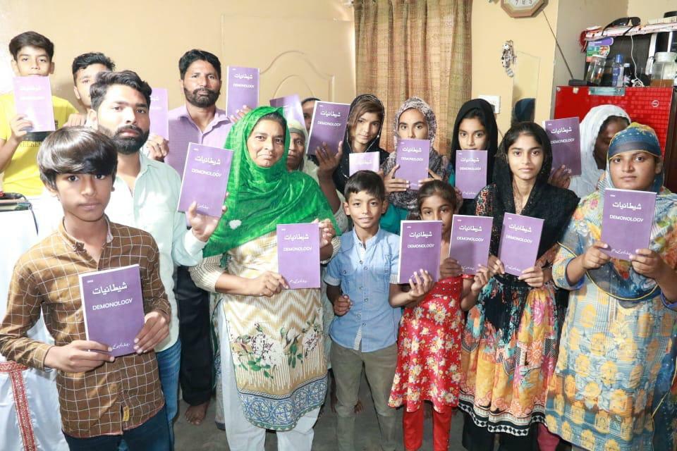 Believers in Pakistan with their new books.