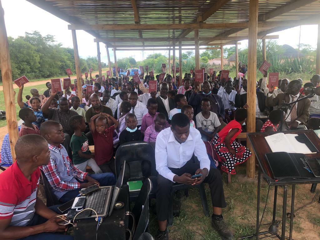 Believers gathering under their new shelter.